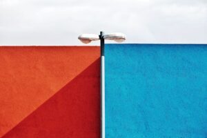 street lamp over blue and red wall
